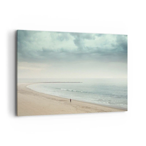 Obraz na płótnie - Samotna postać na opustoszałej plaży przy spokojnym morzu - 100x70cm - w poszukiwaniu spokoju - Nowoczesna dekoracja ścienna do salonu, kuchni i sypialni ARTTOR