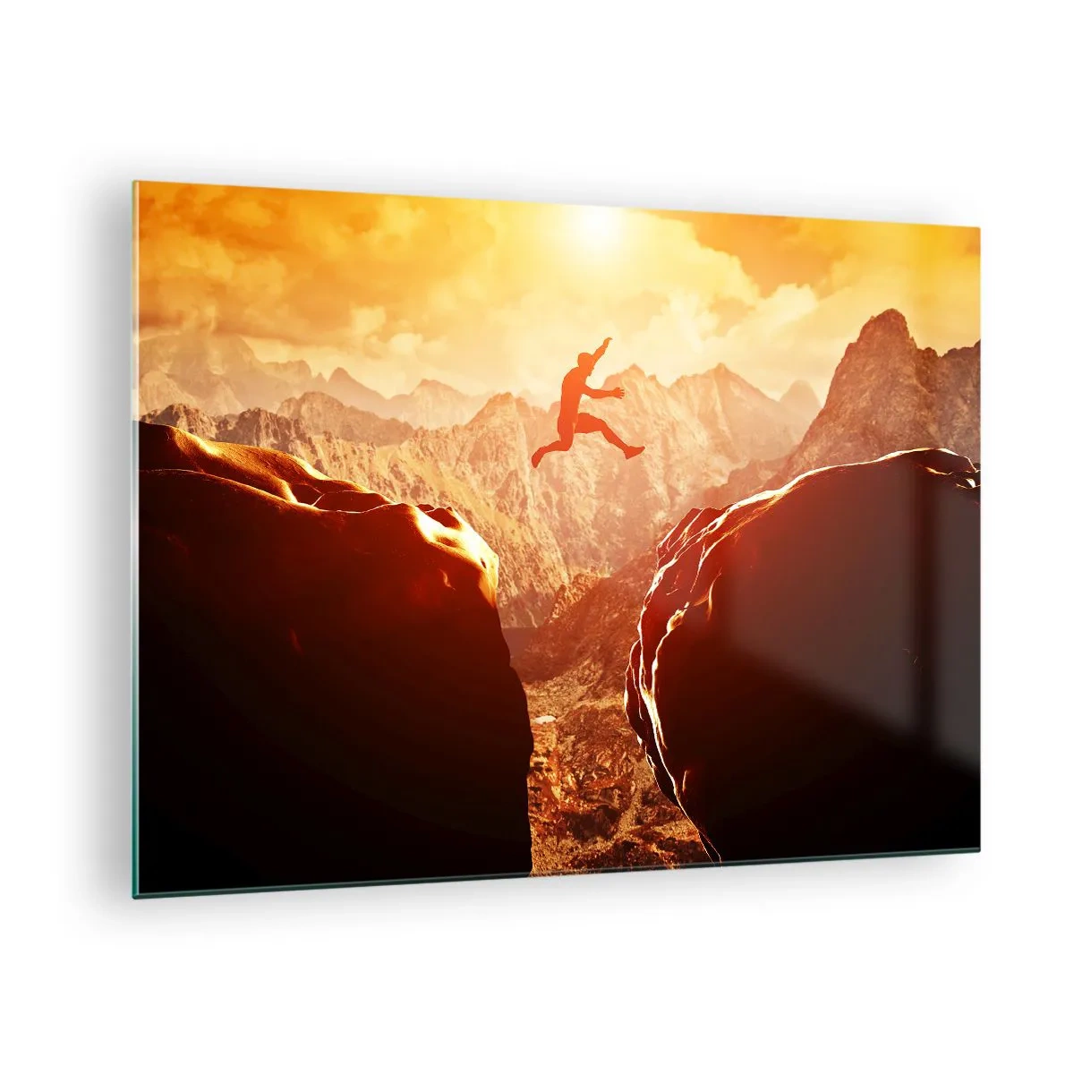 Obraz na szkle - Skok przez przepaść w górskim krajobrazie o zachodzie słońca - 70x50cm - Przekraczając granice - Nowoczesna dekoracja ścienna do salonu i sypialni ARTTOR