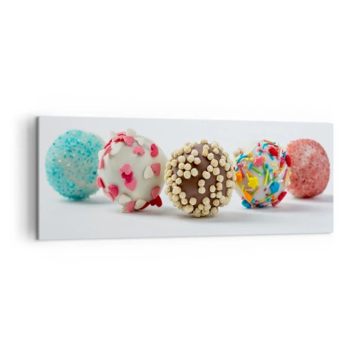 Obraz na płótnie - Kolorowe praliny z dekoracjami na białym tle - 140x50cm - Życie może być słodkie - Nowoczesna dekoracja ścienna do salonu i sypialni ARTTOR