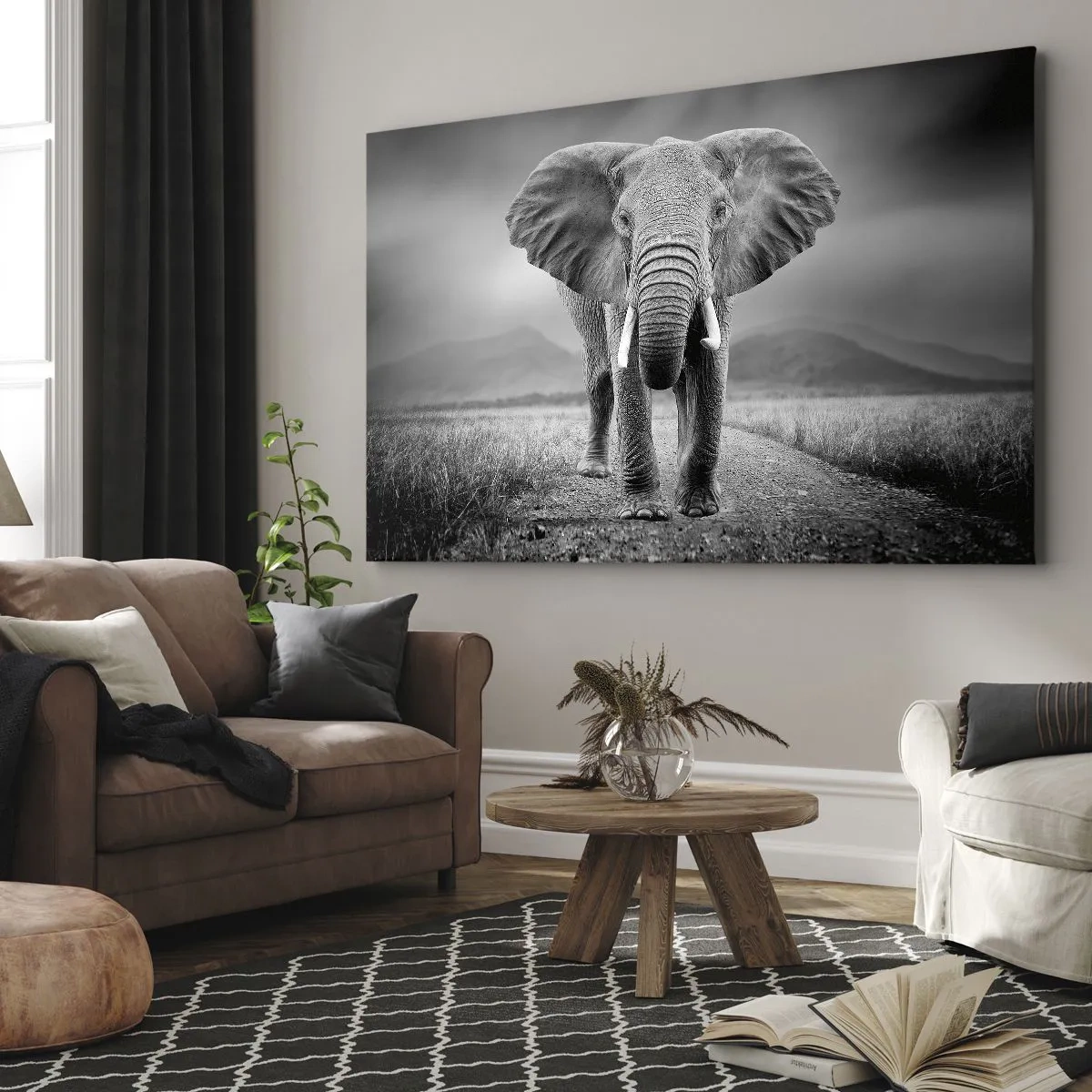 Obraz na płótnie - Potężny słoń na sawannie w monochromatycznej tonacji - 70x50cm - Gospodarz wita - Nowoczesna dekoracja ścienna do salonu i sypialni ARTTOR