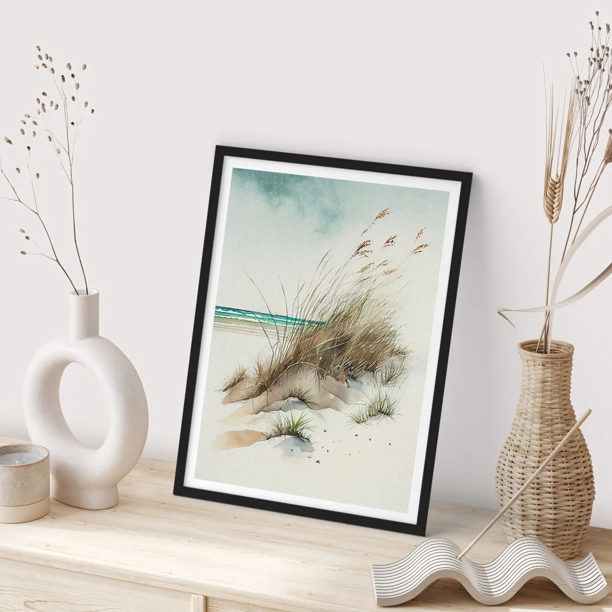 Plakat w czarnej ramie - Wydmy z trawami przy spokojnym morzu w akwarelowym stylu - 50x70cm - Otulone piaskiem - Nowoczesna dekoracja ścienna do salonu i sypialni ARTTOR