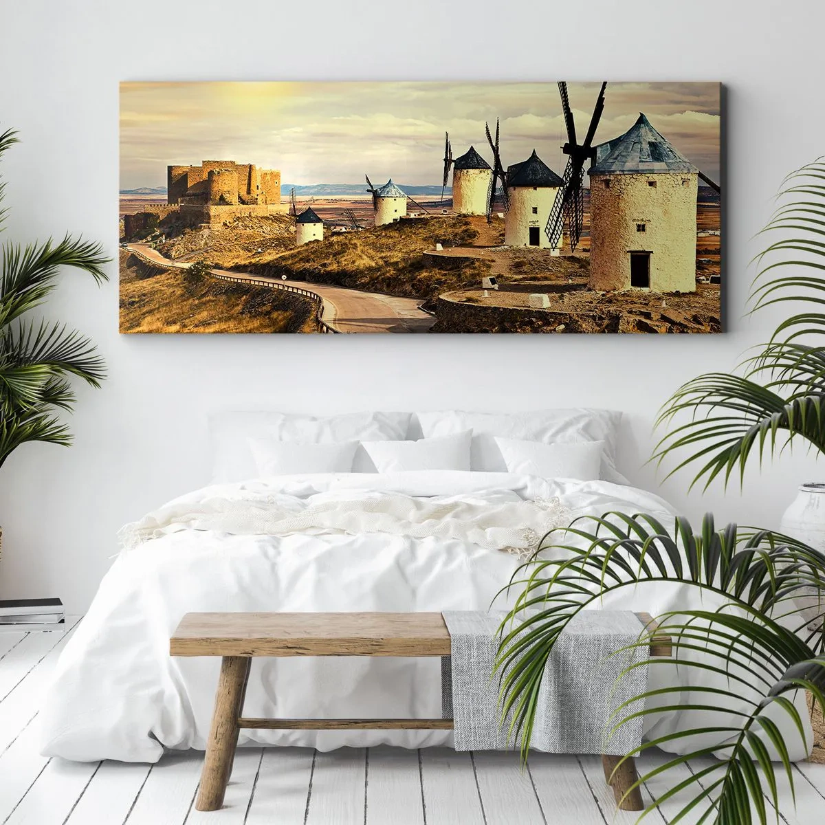 Obraz na płótnie - Wiatraki na wzgórzach z historycznym zamkiem w tle - 120x50cm - Zaraz pojawi się Don Kichot - Nowoczesna dekoracja ścienna do salonu i sypialni ARTTOR