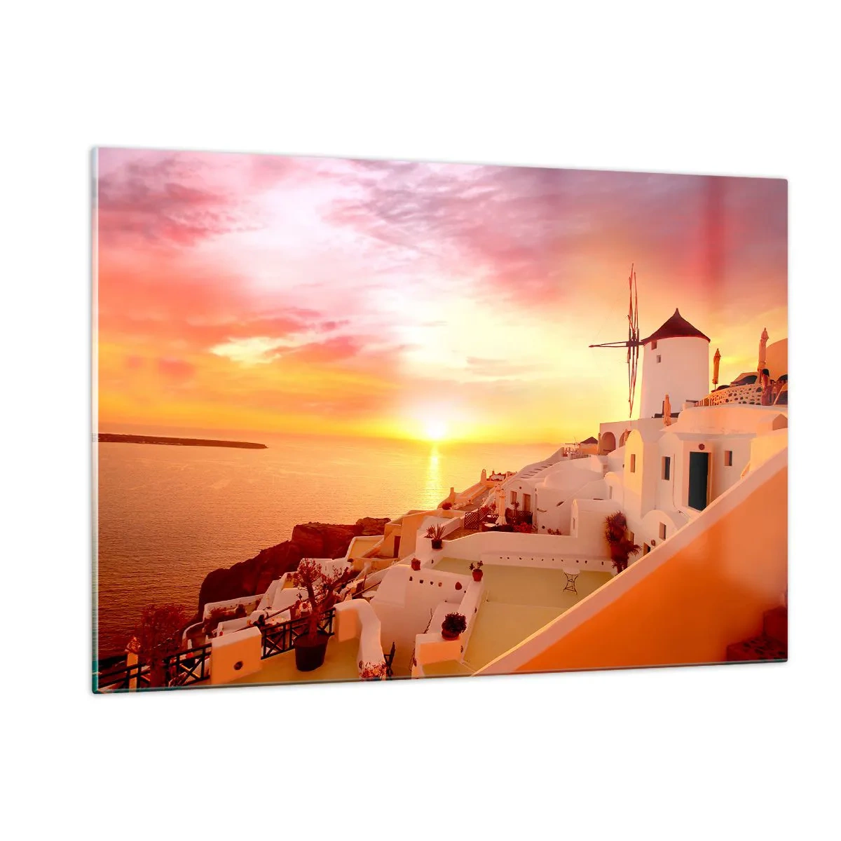 Obraz na szkle - Zachód słońca nad Santorini z białymi budynkami i wiatrakiem - 120x80cm - Rozpłynąć się w bieli i złocie - Nowoczesna dekoracja ścienna do salonu, kuchni i sypialni ARTTOR