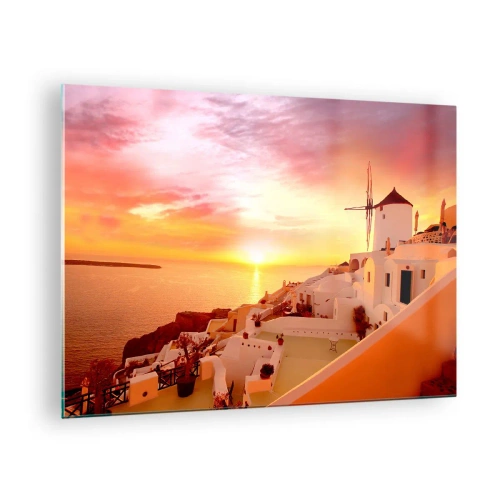 Obraz na szkle - Zachód słońca nad Santorini z białymi budynkami i wiatrakiem - 70x50cm - Rozpłynąć się w bieli i złocie - Nowoczesna dekoracja ścienna do salonu i sypialni ARTTOR