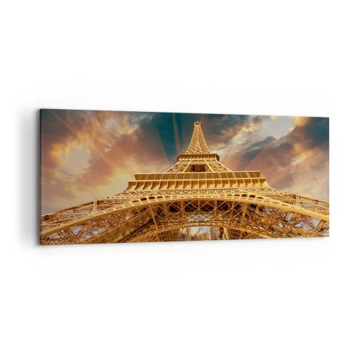 Obraz na płótnie - Wieża Eiffla z perspektywy dolnej na tle zachodzącego słońca - 120x50cm - Jak ludzkość sięgnęła nieba - Nowoczesna dekoracja ścienna do salonu i sypialni ARTTOR