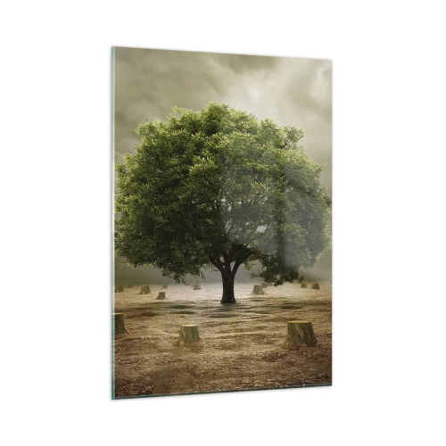 Obraz na szkle - Zielone drzewo otoczone pniami na tle ponurego nieba - 50x70cm - Cała nadzieja - Nowoczesna dekoracja ścienna do salonu, kuchni i sypialni ARTTOR