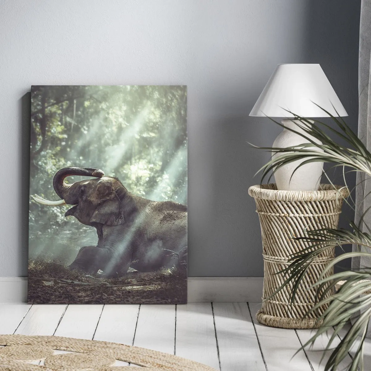 Obraz na płótnie - Chłopiec i słoń w leśnej scenerii oświetlonej promieniami słońca - 70x100cm - A posłuchaj tego… - Nowoczesna dekoracja ścienna do salonu i sypialni ARTTOR