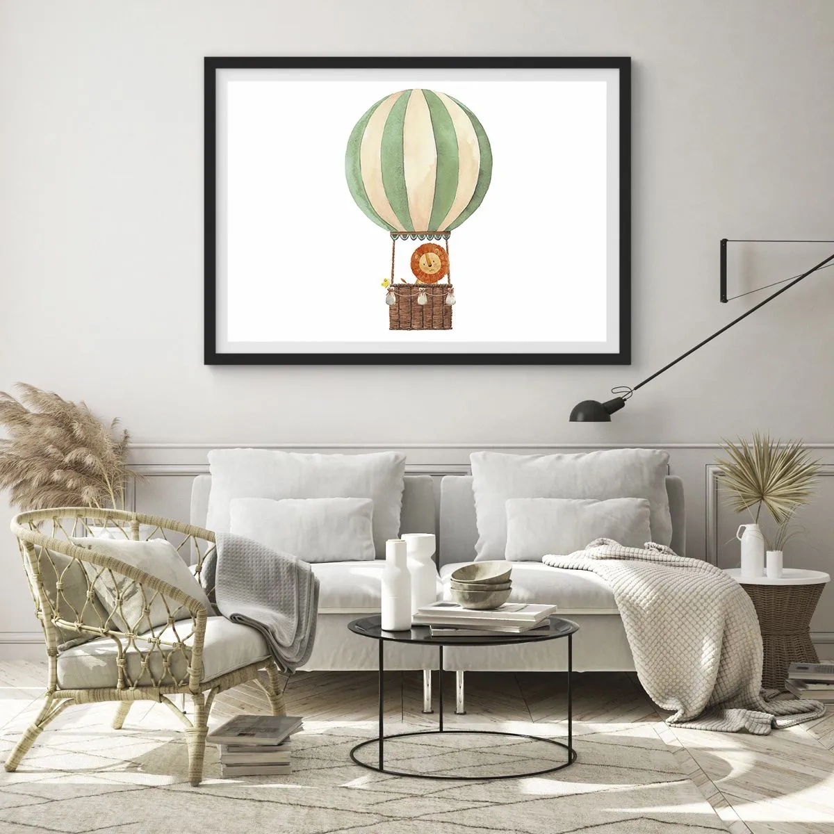 Plakat w czarnej ramie - Balon z uśmiechniętym lwem w koszu w pastelowych barwach - 70x50cm - Podróże Leona - Nowoczesna dekoracja ścienna do salonu i sypialni ARTTOR