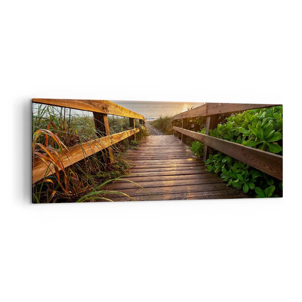 Obraz na płótnie - Drewniany pomost prowadzący na plażę o zachodzie słońca - 140x50cm - I wprost nad brzeg - Nowoczesna dekoracja ścienna do salonu i sypialni ARTTOR