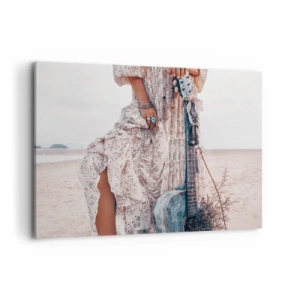 Obraz na płótnie - Kobieta w stylu boho z gitarą na plaży - 100x70cm - Dzieci kwiaty w drodze - Nowoczesna dekoracja ścienna do salonu, kuchni i sypialni ARTTOR