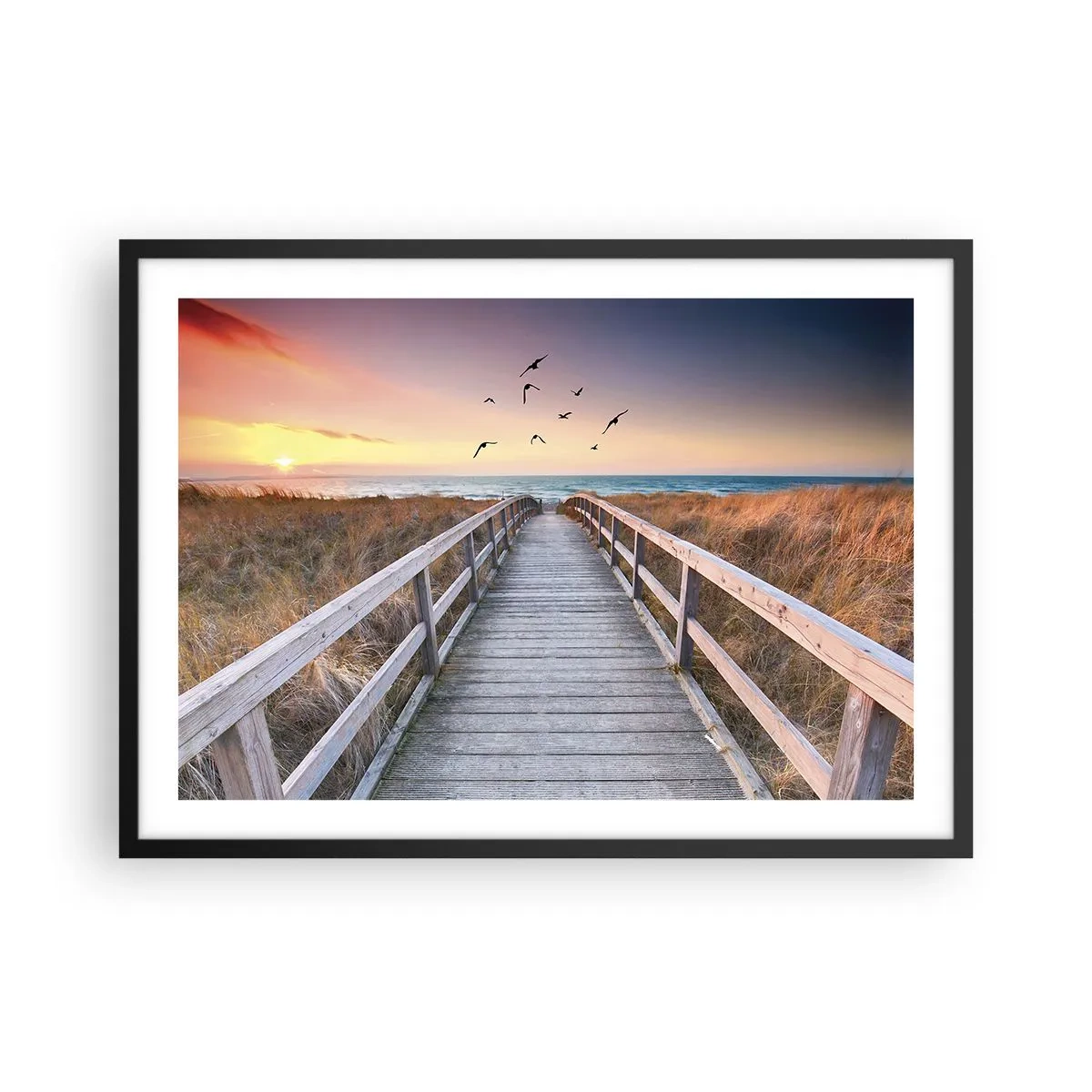 Plakat w czarnej ramie - Drewniany pomost prowadzący na plażę o zachodzie słońca - 70x50cm - Przestrzeń wzlotów - Nowoczesna dekoracja ścienna do salonu i sypialni ARTTOR