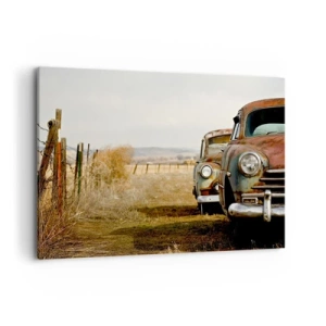 Obraz na płótnie - Dwa stare samochody na polnej drodze przy drewnianym płocie - 100x70cm - Zasłużony odpoczynek - Nowoczesna dekoracja ścienna do salonu, kuchni i sypialni ARTTOR