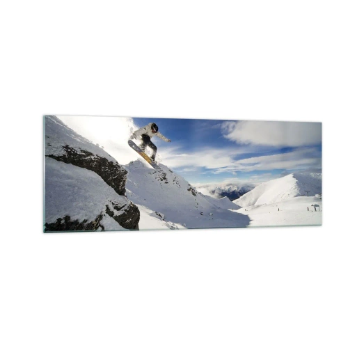 Obraz na szkle - Snowboardzista skaczący z urwiska na tle ośnieżonych gór - 140x50cm - Wolność bez granic - Nowoczesna dekoracja ścienna do salonu i sypialni ARTTOR