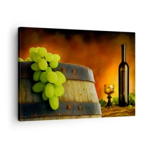 Obraz na płótnie - Winogrona na beczce z winem w tle w ciepłej kolorystyce - 70x50cm - Martwa natura z butelką wina i kiścią winogron - Nowoczesna dekoracja ścienna do salonu i sypialni ARTTOR