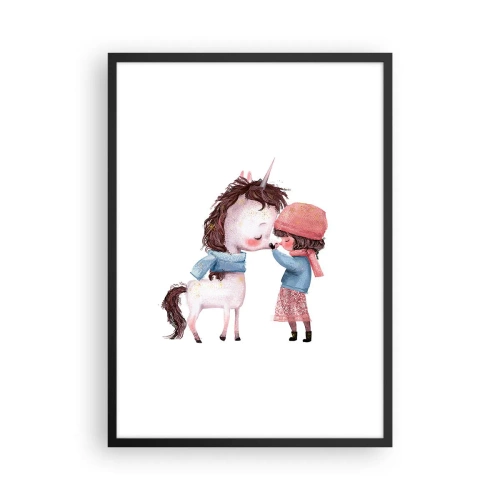Plakat w czarnej ramie - Dziewczynka i jednorożec w zimowych ubraniach przytulają się - 50x70cm - Zimowa opowieść - Nowoczesna dekoracja ścienna do salonu i sypialni ARTTOR