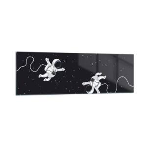 Obraz na szkle - Astronauci unoszący się w kosmosie na tle gwiazd - 160x50cm - Kosmiczny pląs - Nowoczesna dekoracja ścienna do salonu i sypialni ARTTOR