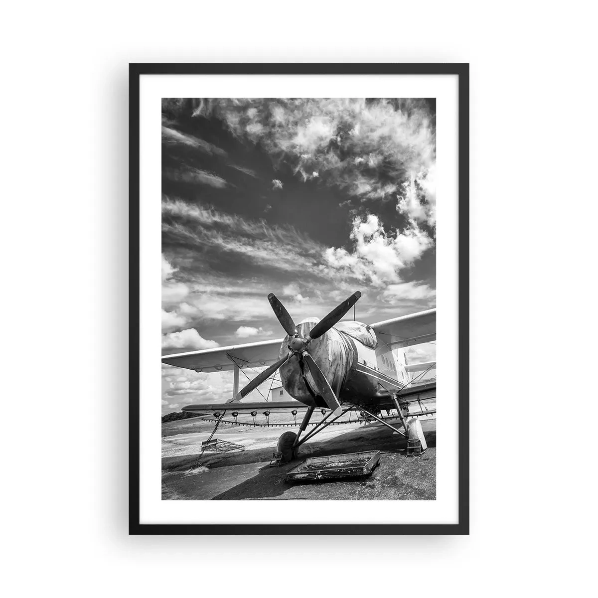 Plakat w czarnej ramie - Czarno-biała fotografia retro samolotu na tle nieba - 50x70cm - Nie mogę się doczekać! - Nowoczesna dekoracja ścienna do salonu i sypialni ARTTOR