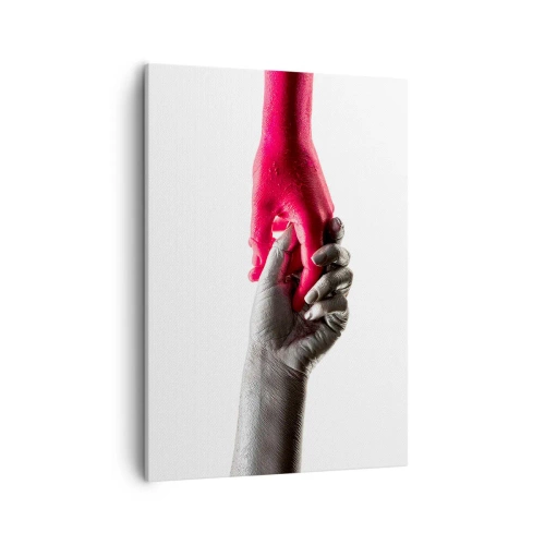 Obraz na płótnie - Czarno-biała dłoń trzymająca intensywnie różową rękę - 50x70cm - Razem, choć inni - Nowoczesna dekoracja ścienna do salonu, kuchni i sypialni ARTTOR