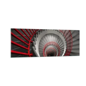 Obraz na szkle - Spiralne schody z czerwonymi poręczami w dynamicznej perspektywie - 140x50cm - Zabawy architektury - Nowoczesna dekoracja ścienna do salonu i sypialni ARTTOR