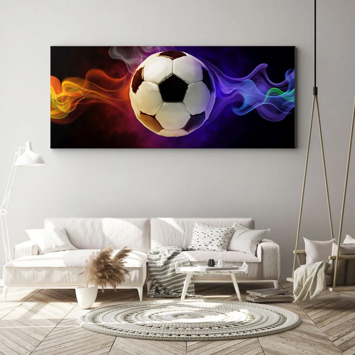 Obraz na płótnie - Piłka nożna otoczona kolorowymi efektami dymu na ciemnym tle - 120x50cm - Magiczna moc gry - Nowoczesna dekoracja ścienna do salonu i sypialni ARTTOR
