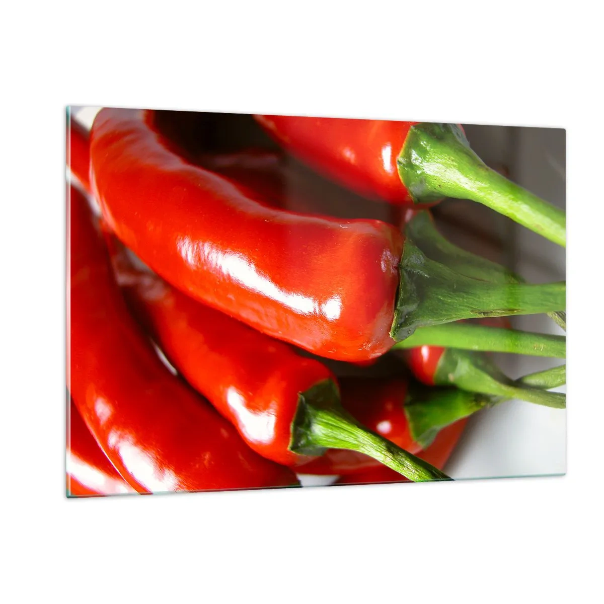 Obraz na szkle - Czerwone papryczki chili z zielonymi szypułkami - 120x80cm - Soczyste, błyszczące, gładkie - Nowoczesna dekoracja ścienna do salonu, kuchni i sypialni ARTTOR