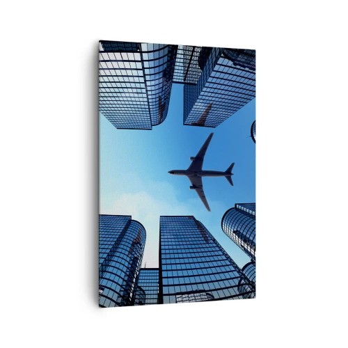 Obraz na płótnie - Samolot lecący nad nowoczesnymi wieżowcami w centrum miasta - 80x120cm - Widok ze szklanego wąwozu - Nowoczesna dekoracja ścienna do salonu i sypialni ARTTOR