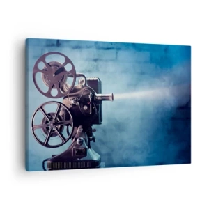Obraz na płótnie - Stary projektor filmowy rzucający światło na tle błękitnej scenerii - 70x50cm - W starym kinie - Nowoczesna dekoracja ścienna do salonu i sypialni ARTTOR