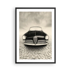 Plakat w czarnej ramie - Przód klasycznego samochodu na brukowanej ulicy - 50x70cm - I jak mnie nie kochać? - Nowoczesna dekoracja ścienna do salonu i sypialni ARTTOR