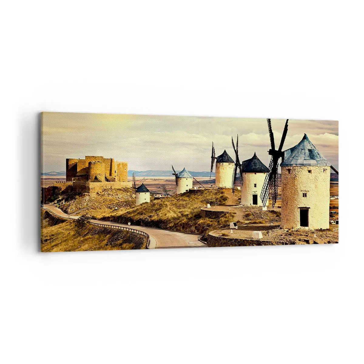 Obraz na płótnie - Wiatraki na wzgórzach z historycznym zamkiem w tle - 120x50cm - Zaraz pojawi się Don Kichot - Nowoczesna dekoracja ścienna do salonu i sypialni ARTTOR