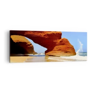 Obraz na płótnie - Naturalny łuk skalny na plaży z błękitnym niebem i falami - 140x50cm - Woda i wiatr przez tysiące lat - Nowoczesna dekoracja ścienna do salonu i sypialni ARTTOR
