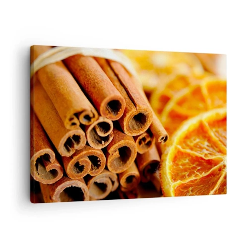 Obraz na płótnie - Laski cynamonu z suszonymi plastrami pomarańczy w ciepłych barwach - 70x50cm - Czujesz ich aromat? - Nowoczesna dekoracja ścienna do salonu i sypialni ARTTOR