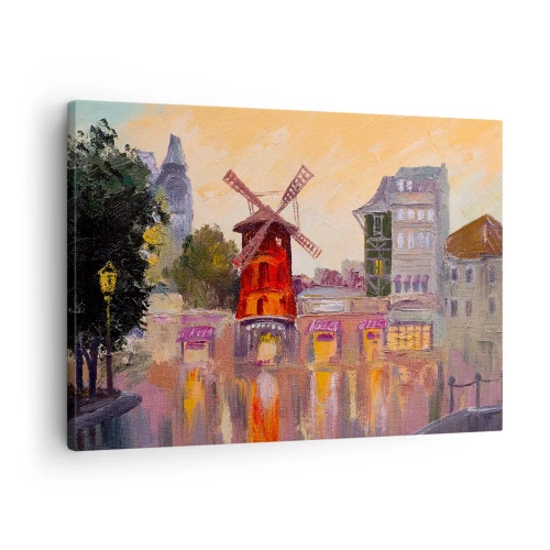 Obraz na płótnie - Czerwony wiatrak Moulin Rouge otoczony miejskim pejzażem - 70x50cm - Paryskie ikony – Moulin Rouge - Nowoczesna dekoracja ścienna do salonu i sypialni ARTTOR