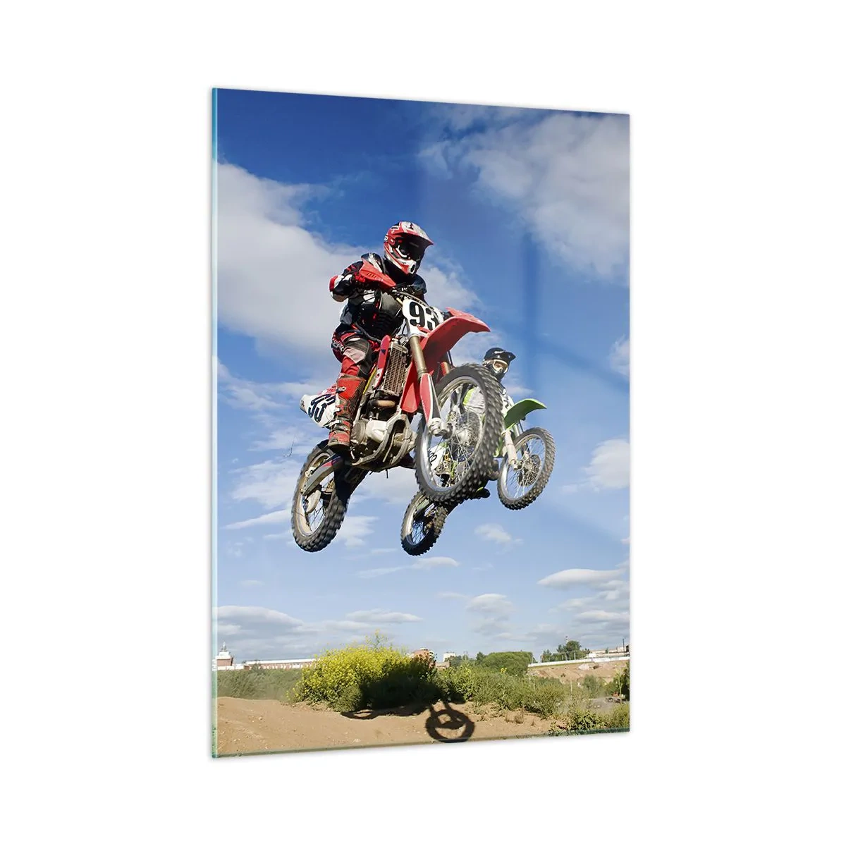 Obraz na szkle - Zawodnik na motocyklu w locie na tle błękitnego nieba - 50x70cm - Podniebny skok - Nowoczesna dekoracja ścienna do salonu, kuchni i sypialni ARTTOR