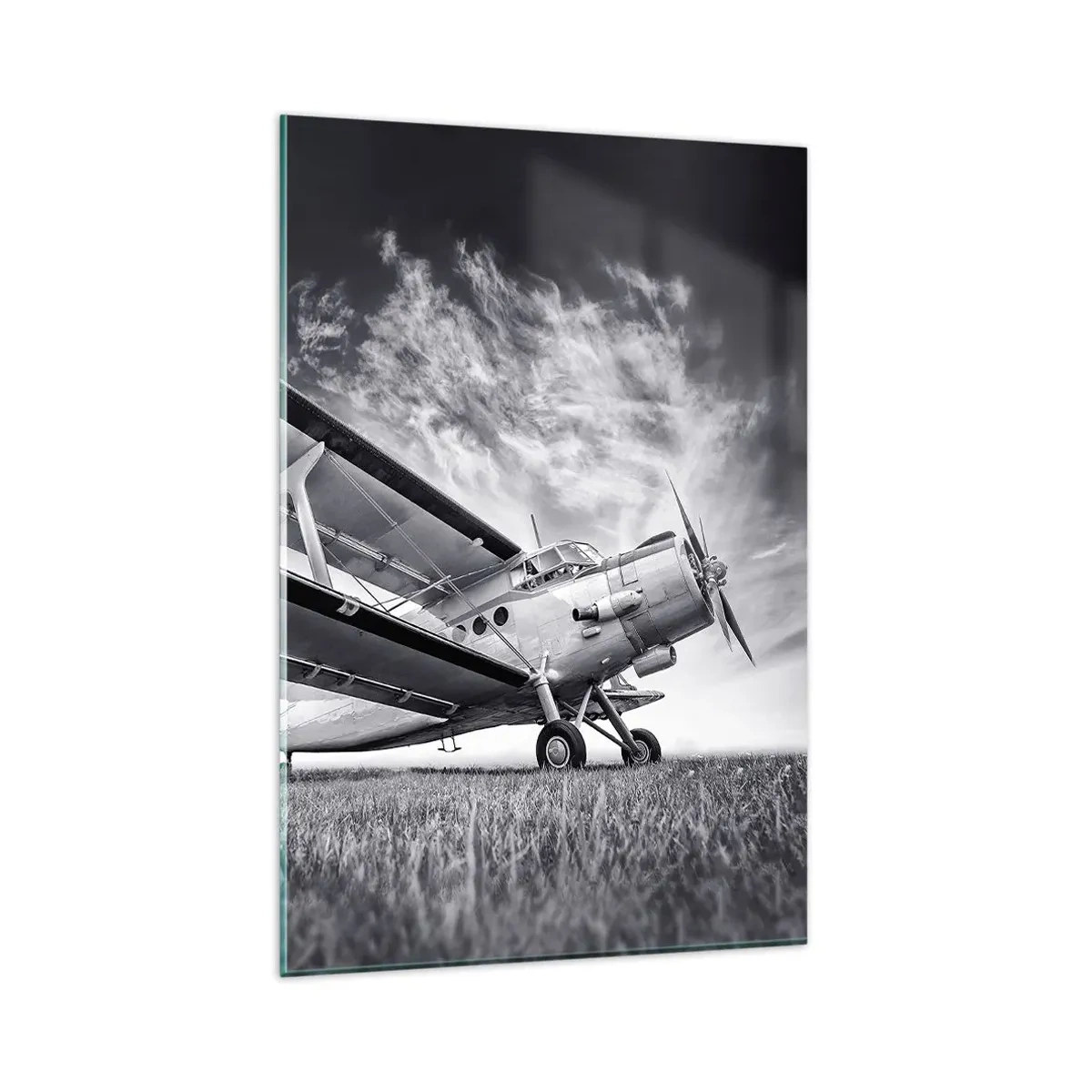 Obraz na szkle - Samolot na tle dramatycznego nieba w czerni i bieli - 80x120cm - Skrzydlaty wędrowiec - Nowoczesna dekoracja ścienna do salonu i sypialni ARTTOR