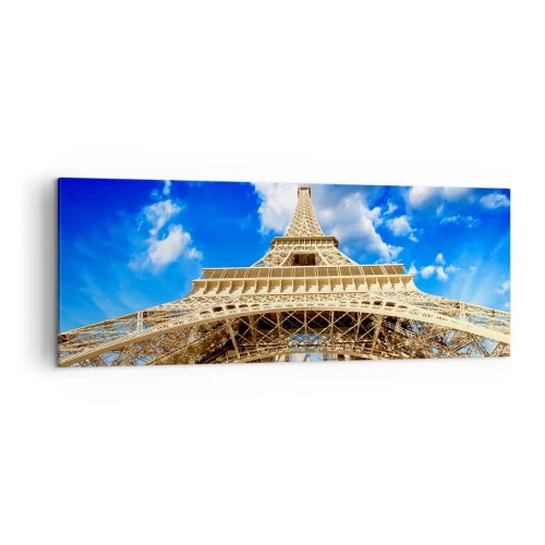 Obraz na płótnie - Wieża Eiffla z perspektywy dolnej na tle błękitnego nieba - 140x50cm - Sięgając nieba i chmur - Nowoczesna dekoracja ścienna do salonu i sypialni ARTTOR