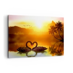 Obraz na płótnie - Dwa czarne łabędzie tworzące serce na tle zachodu słońca nad jeziorem - 100x70cm - Wszystko do pary - Nowoczesna dekoracja ścienna do salonu, kuchni i sypialni ARTTOR