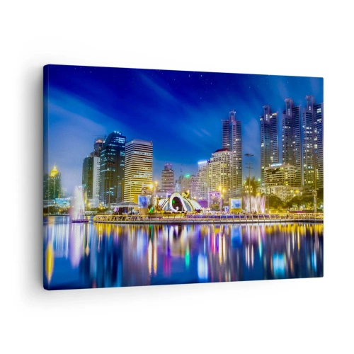 Obraz na płótnie - Nocna panorama miasta z odbiciem świateł na wodzie - 70x50cm - Tęczowa noc metropolii - Nowoczesna dekoracja ścienna do salonu i sypialni ARTTOR