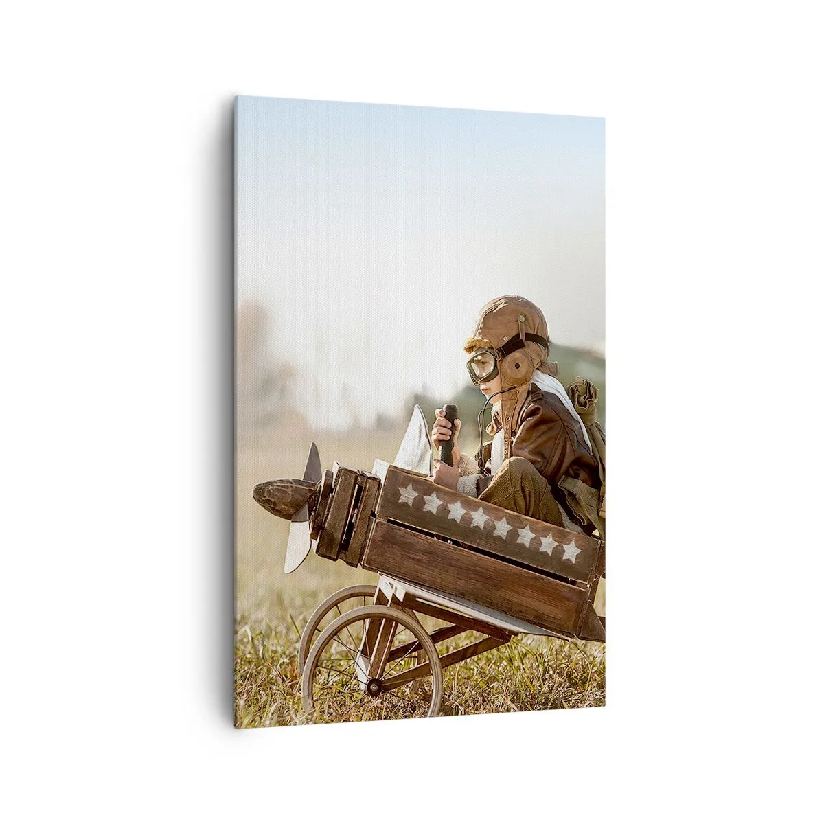 Obraz na płótnie - Dziecko w zabawkowym samolocie na tle pola - 80x120cm - Start ku marzeniu - Nowoczesna dekoracja ścienna do salonu i sypialni ARTTOR