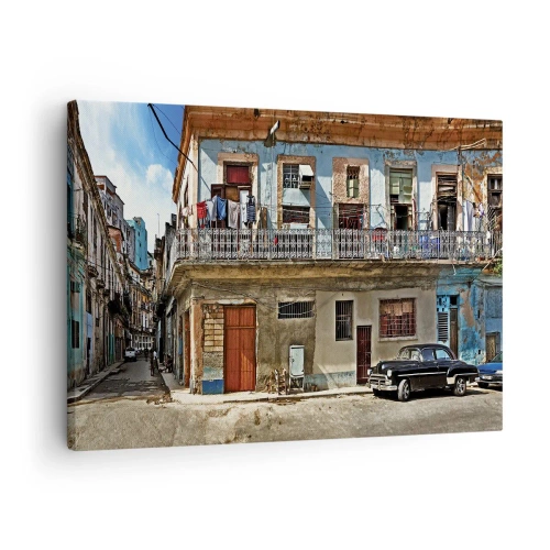 Obraz na płótnie - Kolorowe kamienice i klasyczny samochód w miejskim krajobrazie - 70x50cm - Hawańskie klimaty - Nowoczesna dekoracja ścienna do salonu i sypialni ARTTOR