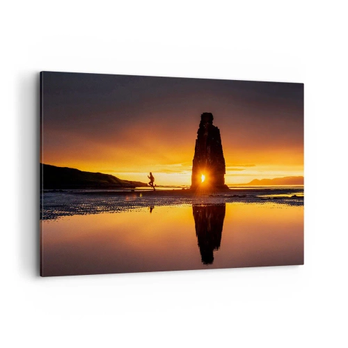 Obraz na płótnie - Osoba biegnąca na plaży o zachodzie słońca z formacją skalną - 120x80cm - Tylko ty i natura - Nowoczesna dekoracja ścienna do salonu, kuchni i sypialni ARTTOR
