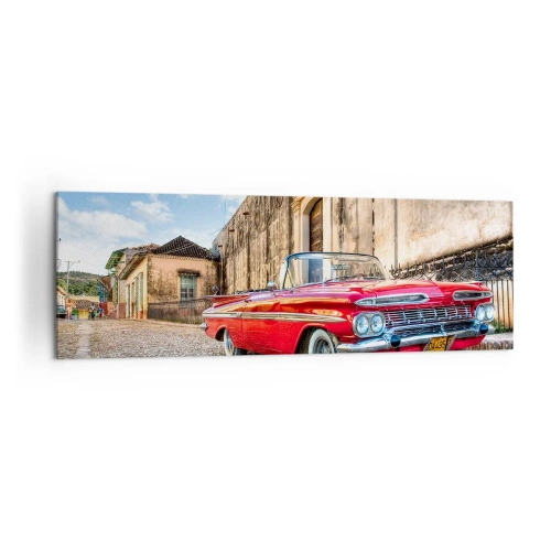 Obraz na płótnie - Czerwony klasyczny samochód na brukowanej uliczce - 160x50cm - Kubańskie wzruszenia - Nowoczesna dekoracja ścienna do salonu i sypialni ARTTOR