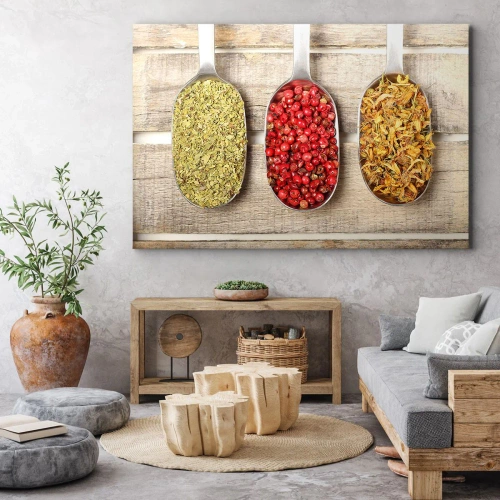 Obraz na płótnie - Kuchenna magia - Trzy metalowe łyżki z przyprawami na drewnianym tle - 70x50cm