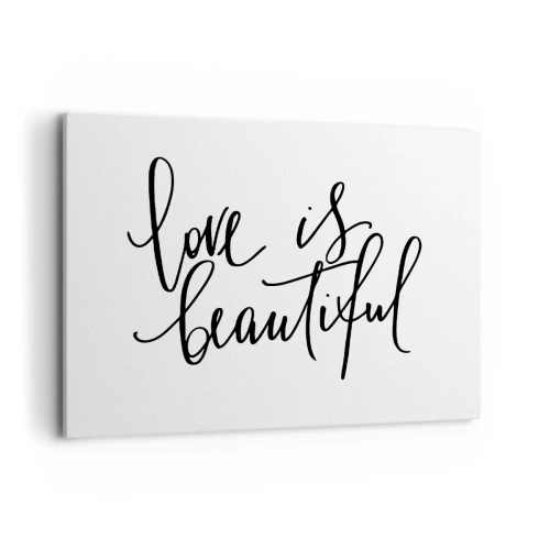 Obraz na płótnie - Czarny napis love is beautiful na białym tle - 100x70cm - Czytaj i powtarzaj - Nowoczesna dekoracja ścienna do salonu, kuchni i sypialni ARTTOR
