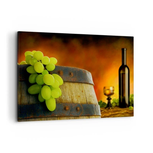 Obraz na płótnie - Winogrona na beczce z winem w tle w ciepłej kolorystyce - 100x70cm - Martwa natura z butelką wina i kiścią winogron - Nowoczesna dekoracja ścienna do salonu, kuchni i sypialni ARTTOR