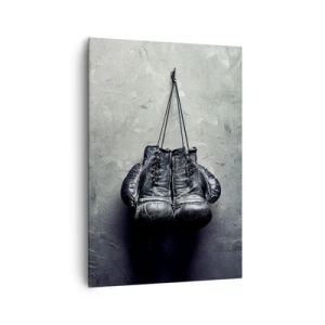 Obraz na płótnie - Stare rękawice bokserskie na tle ściany - 70x100cm - Czas walki i czas pokoju - Nowoczesna dekoracja ścienna do salonu i sypialni ARTTOR