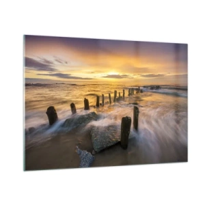 Obraz na szkle - Zachód słońca nad morzem z drewnianymi palami na plaży - 100x70cm - Surowe piękno Bałtyku - Nowoczesna dekoracja ścienna do salonu, kuchni i sypialni ARTTOR