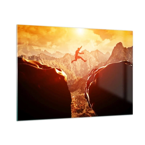 Obraz na szkle - Skok przez przepaść w górskim krajobrazie o zachodzie słońca - 100x70cm - Przekraczając granice - Nowoczesna dekoracja ścienna do salonu, kuchni i sypialni ARTTOR