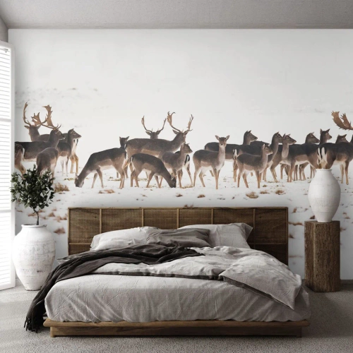 Fototapeta Premium Canvas - Stado jeleni na śnieżnym tle - 100x70cm - Idą święta? - Nowoczesna dekoracja ścienna do salonu i sypialni ARTTOR