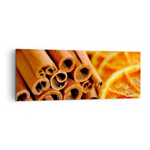 Obraz na płótnie - Laski cynamonu z suszonymi plastrami pomarańczy w ciepłych barwach - 140x50cm - Czujesz ich aromat? - Nowoczesna dekoracja ścienna do salonu i sypialni ARTTOR