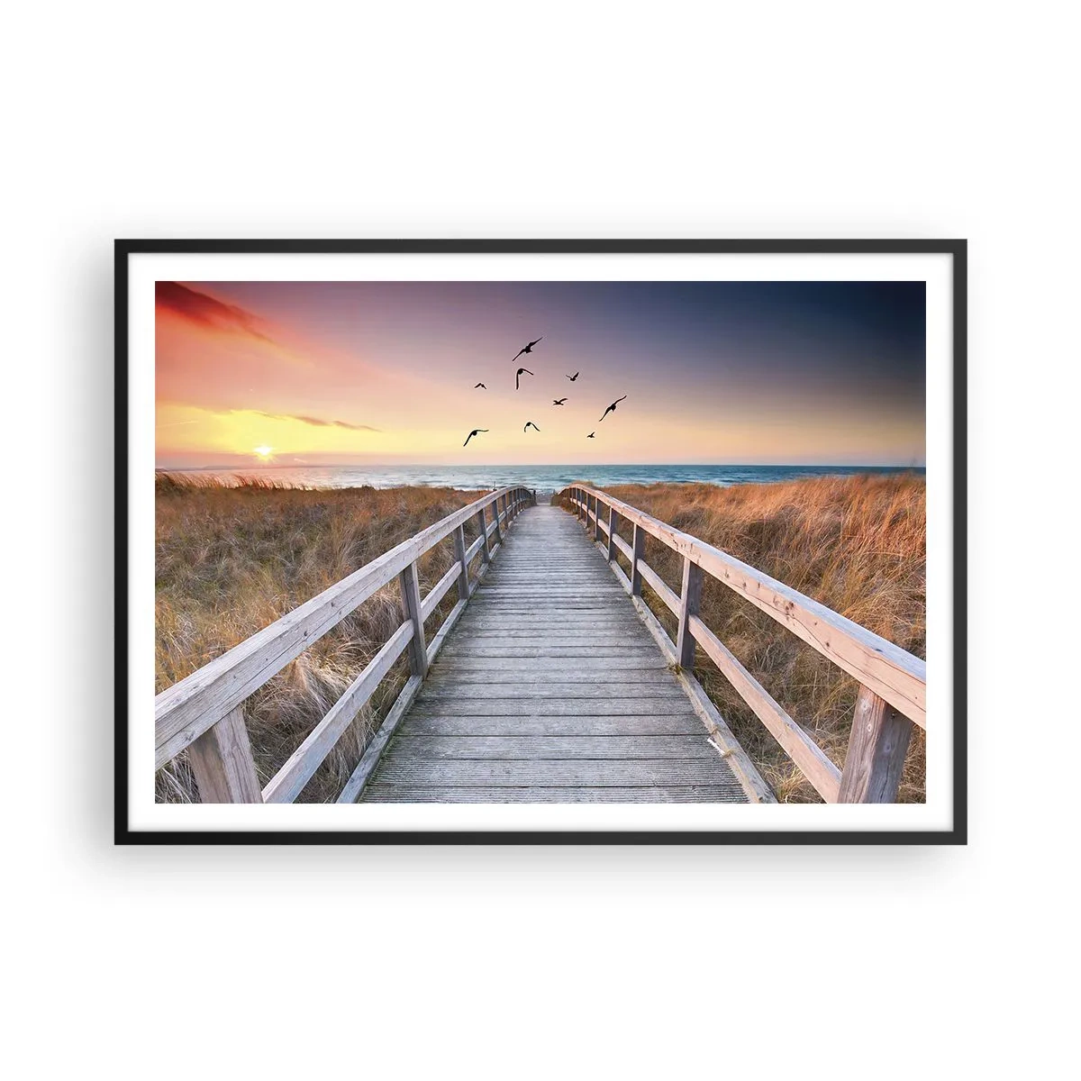 Plakat w czarnej ramie - Drewniany pomost prowadzący na plażę o zachodzie słońca - 100x70cm - Przestrzeń wzlotów - Nowoczesna dekoracja ścienna do salonu i sypialni ARTTOR